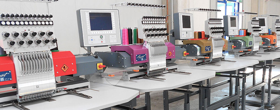 A row of multi-head ZSK embroidery machines in the Krefeld assembly hall