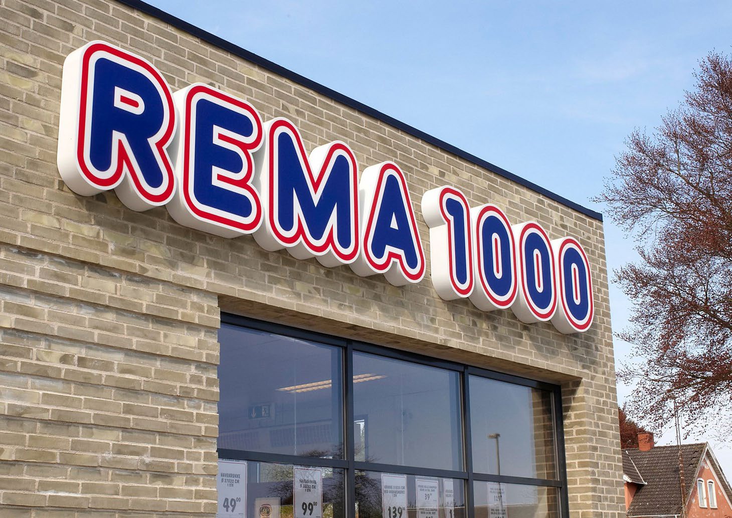 The REMA 1000 sign on the front of a store