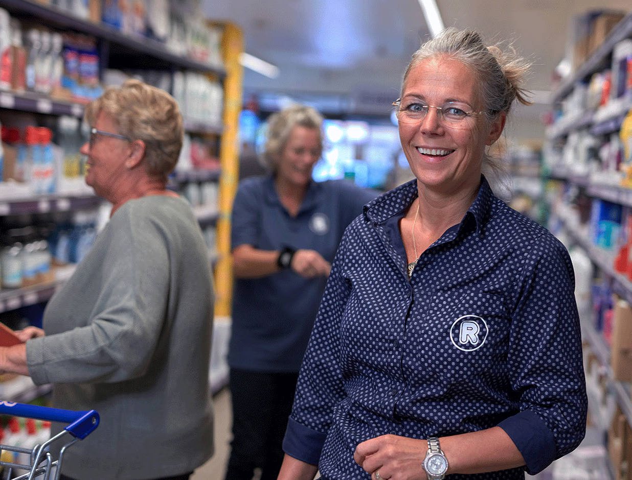 Staff working on the shop floor of a REMA 1000 store