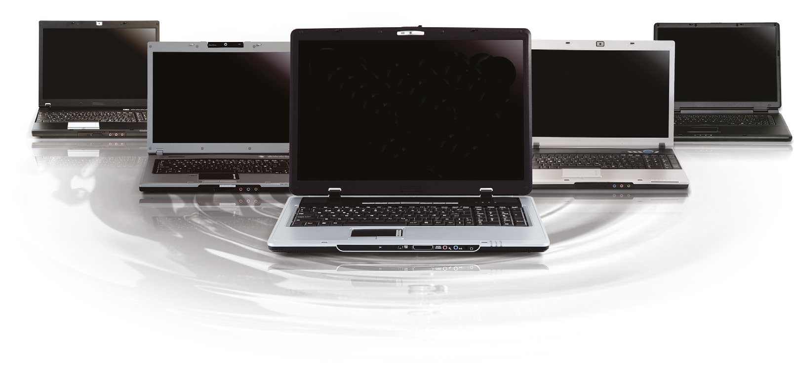 A row of open laptops of different sizes arranged in a fan